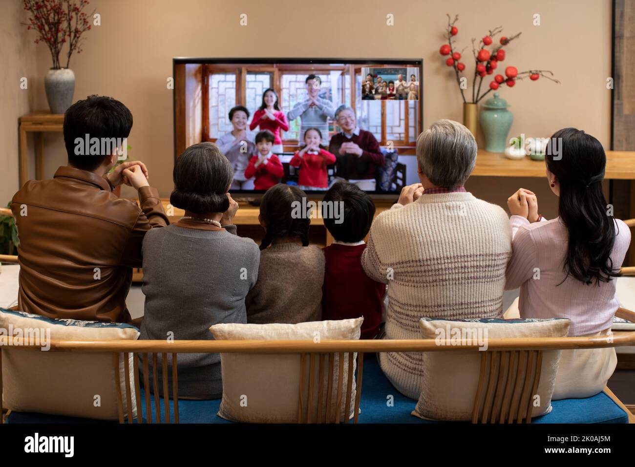 Happy family having video chat during Chinese New Year Stock Photo