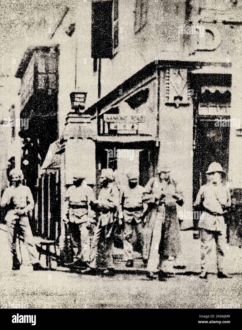 Louza Station (Presently No. 772 on East Nanjing Road, Shanghai) is densely populated by Xibu personnel. Xibu are British patrol members. This was pictured during the May Thirtieth Movement. The May Thirtieth Movement was a major labour and patriotic movement against imperialist powers led by the Chinese Communist Party. Stock Photo