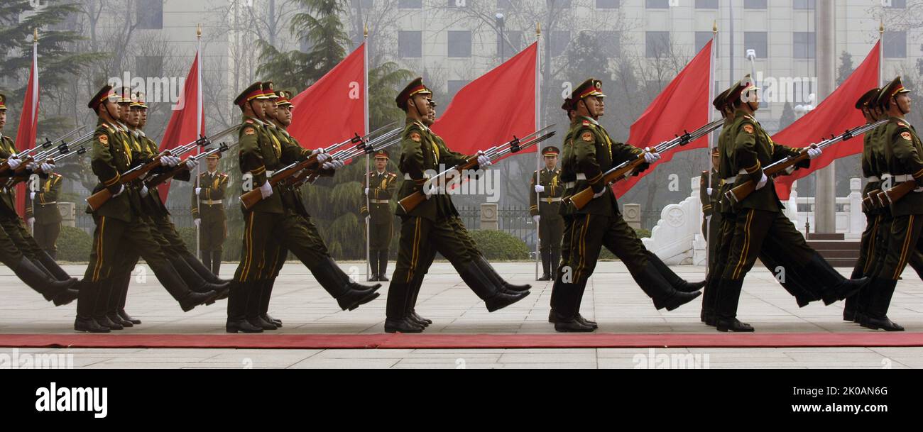 Members of a Chinese military honor guard march during a welcome ceremony for US Chairman of the Joint Chiefs of Staff Marine Gen. Peter Pace at the Ministry of Defense in Beijing, China. 2012 Stock Photo