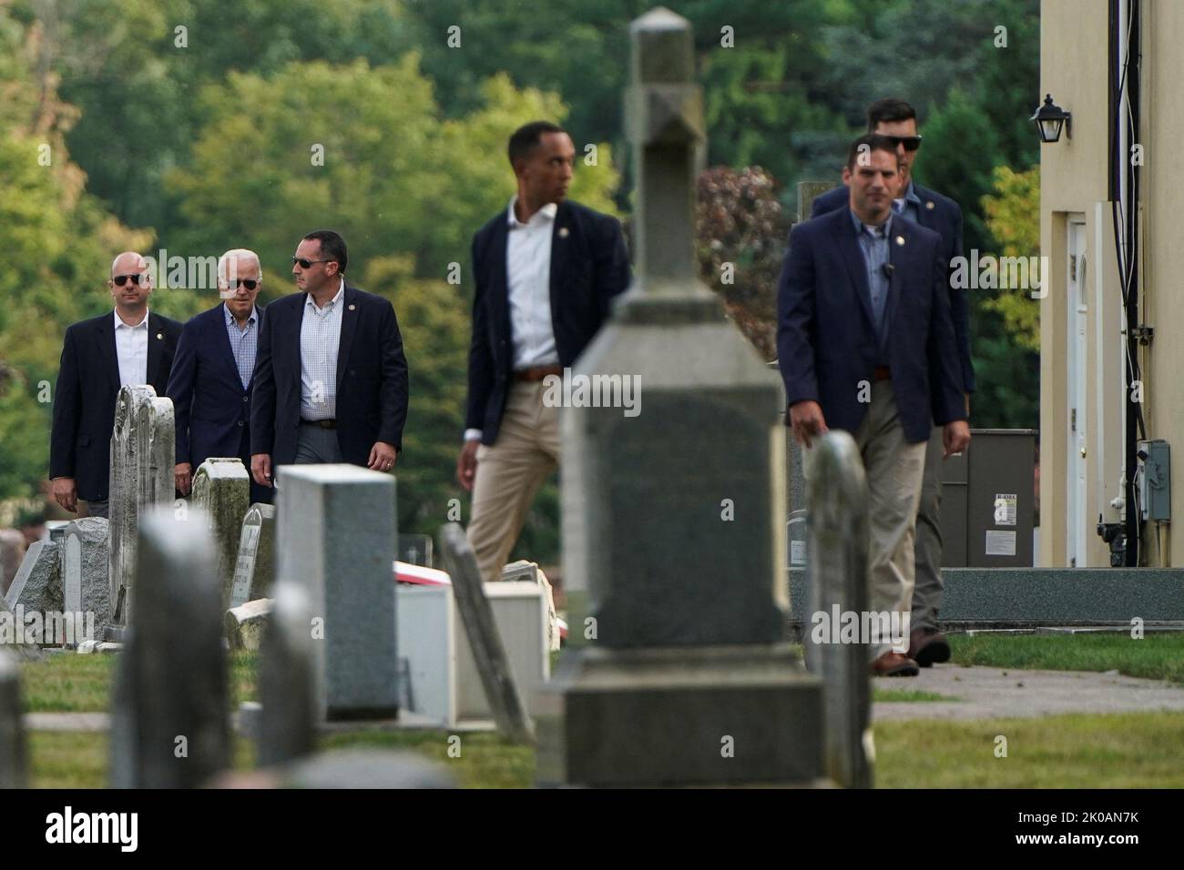 U.S. President Joe Biden walks with Secret Service agents after visiting the family grave plot at St. Joseph on the Brandywine Catholic Church after attending Mass in Wilmington, Delaware, U.S., September 10, 2022.  REUTERS/Joshua Roberts Stock Photo