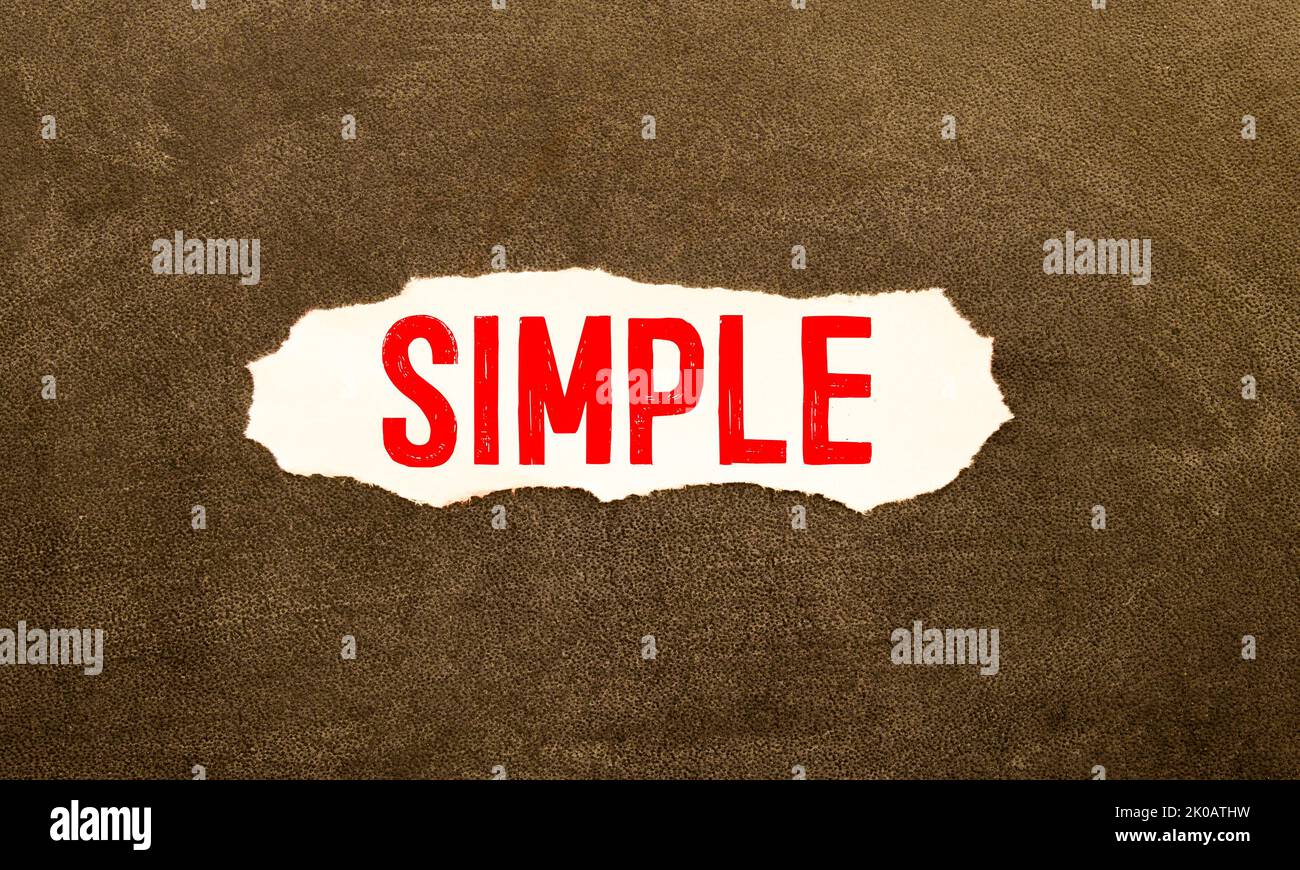 Simple of the word on paper. concept. Words of Simple on a wooden background Stock Photo
