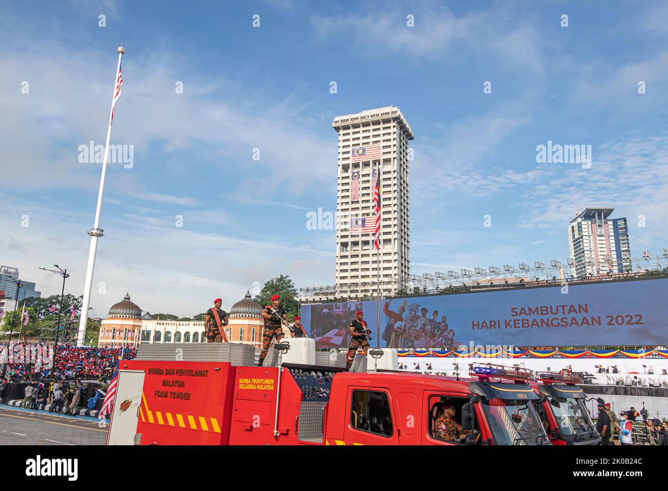 Malaysian firefighter and rescue personals posing on fire and rescue truck during 65 Malaysia National Day Parade in Kuala Lumpur, Malaysia. Stock Photo