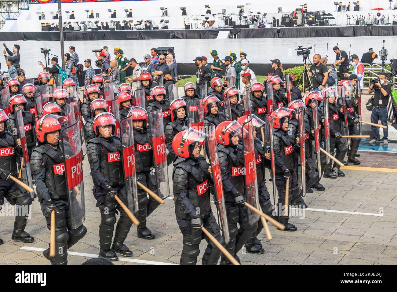 Malaysian anti riot polices or Federal Reserve Unit marching with batons and shields during 65th Malaysia National Day parade in Kuala Lumpur. Stock Photo