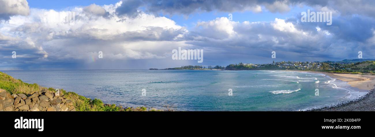 View to Kiama across Bombo beach, NSW, Australia, view across Bombo beach from Bombo Headland after winter storm, panorama view Stock Photo
