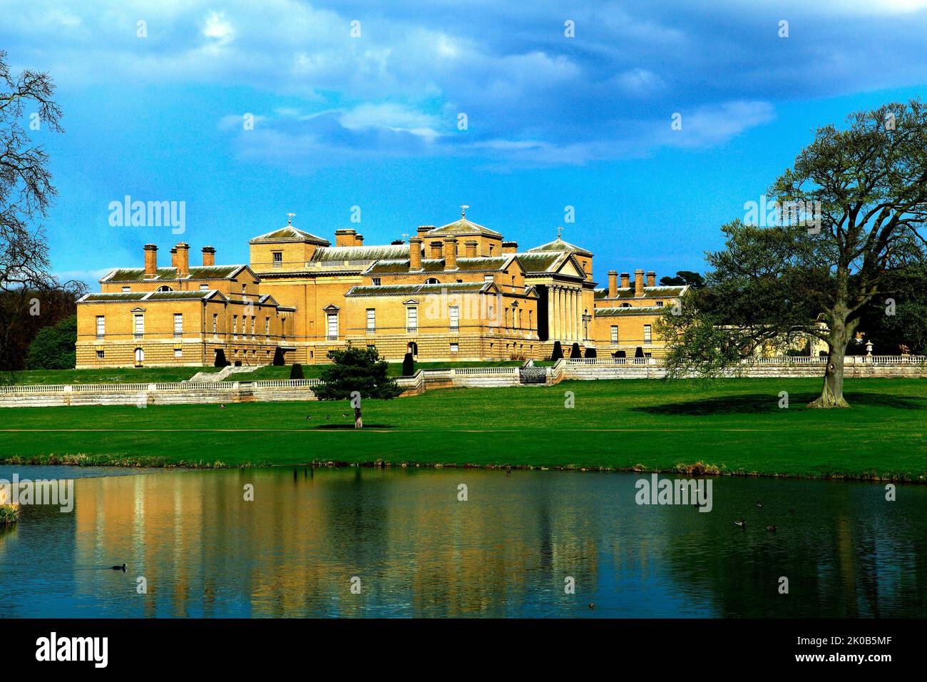Holkham Hall, Norfolk, viewed across lake, English stately home, Palladian mansion, England, UK Stock Photo