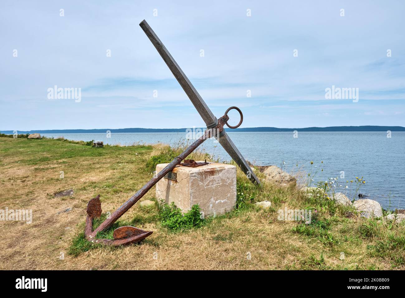 Antique anchor donated from one of the founding families of Gilbert's Cove Nova Scotia on display at the waterfront. Stock Photo