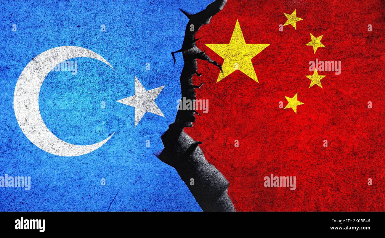 East Turkestan vs China flags on a wall with a crack. Uyghur China conflict. China and East Turkistan conflict, war crisis concept Stock Photo