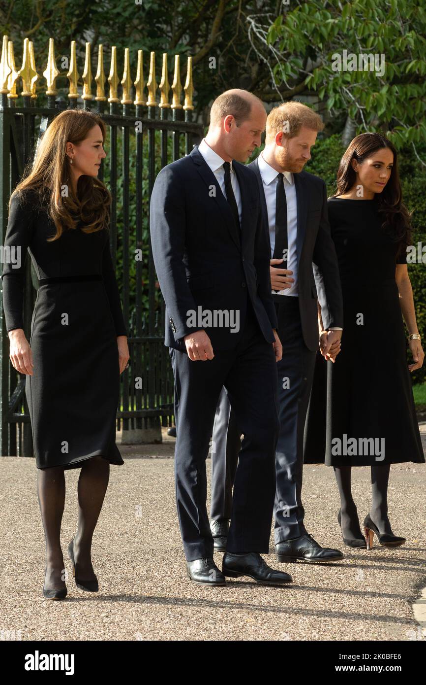 Windsor, UK. 10th September, 2022. Prince William and Catherine, the new Prince and Princess of Wales, accompanied by Prince Harry and Meghan, the Duke and Duchess of Sussex, arrive to view floral tributes laid outside Cambridge Gate at Windsor Castle following the death of Queen Elizabeth II. Queen Elizabeth II, the UK's longest-serving monarch, died at Balmoral aged 96 on 8th September 2022 after a reign lasting 70 years. Credit: Mark Kerrison/Alamy Live News Stock Photo