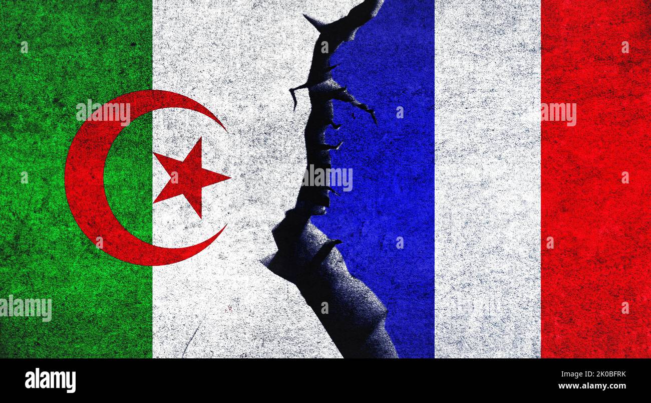 France vs Algeria flags on a wall with crack. Algeria and France political conflict, economy, war crisis, relationship, trade concept Stock Photo