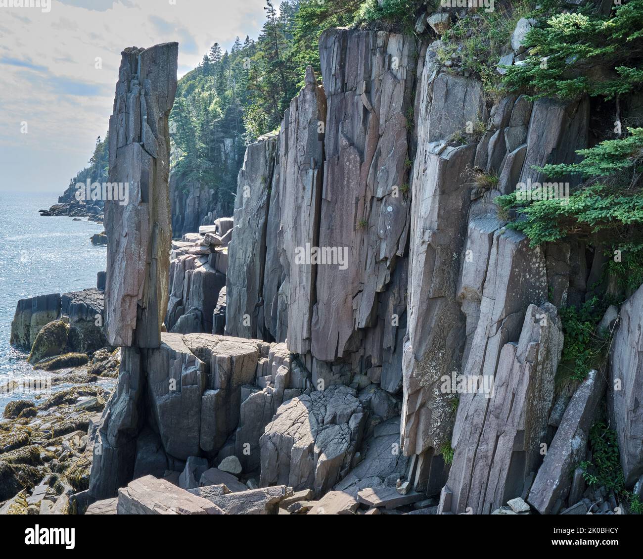 Located near Tiverton Nova Scotia balancing rock is a 20 ton slab of volcanic basalt that appears to be balancing precariously on a ledge. Stock Photo