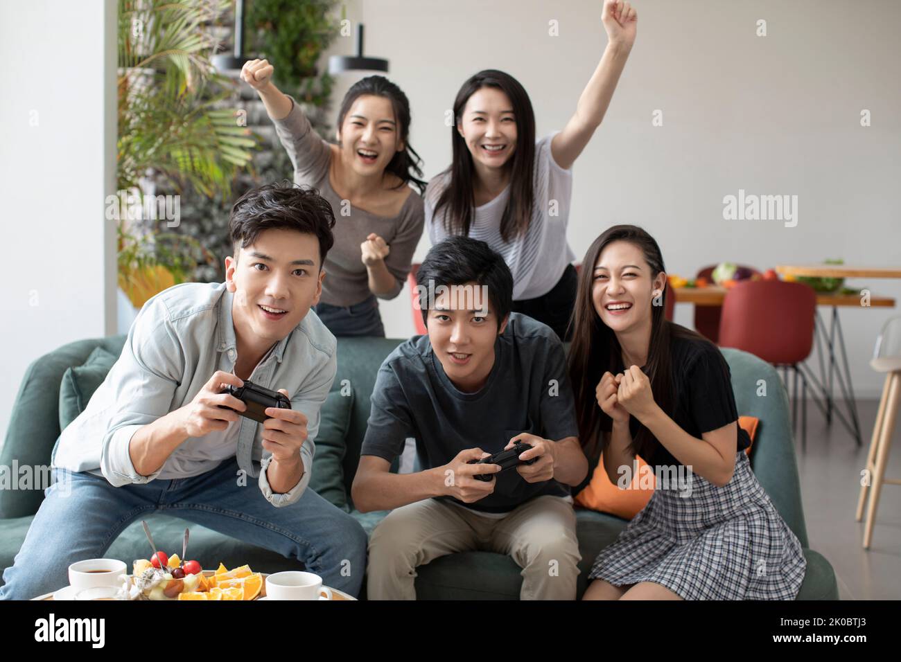 Happy Chinese friends having fun together Stock Photo - Alamy