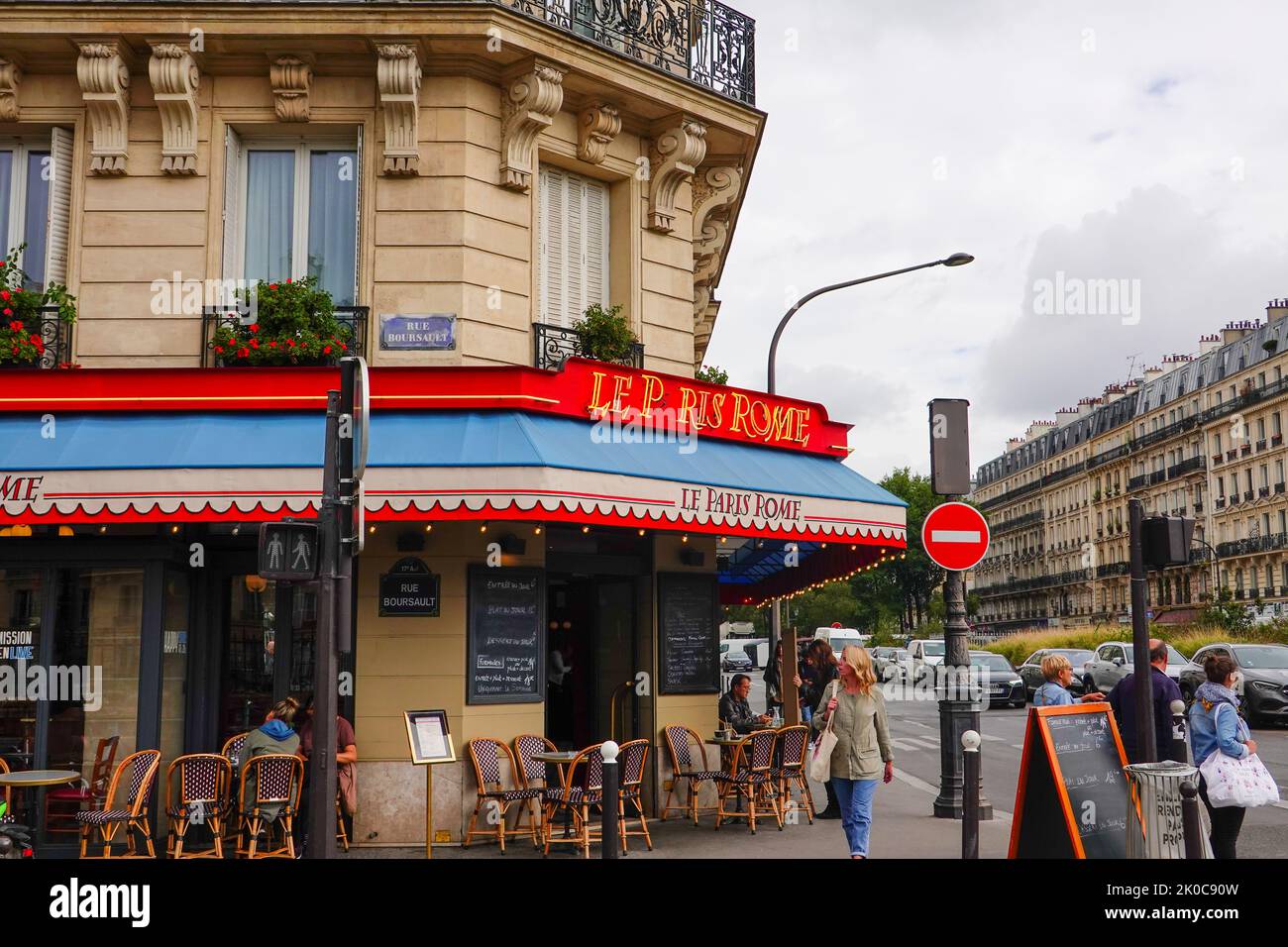 Cafe chairs outside Brasserie Le Paris Rome, restaurant in the Batignolles area of the 17th Arrondissement, at Rome stop, Metro Line 2, Paris, France. Stock Photo