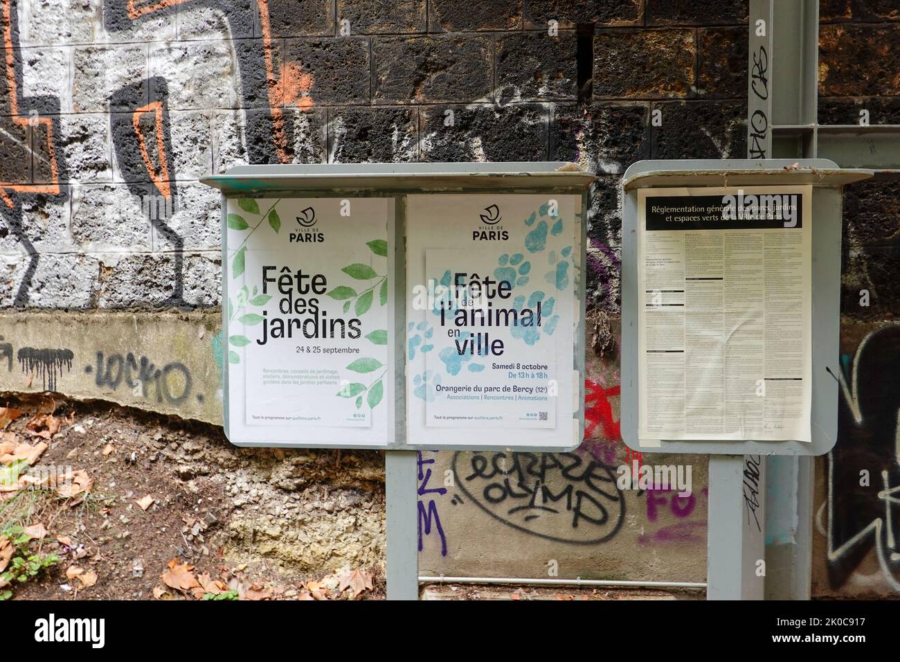 City of Paris, France signs, posted in a petite censure park, welcoming people to celebrate the gardens in September and animals in October. Stock Photo