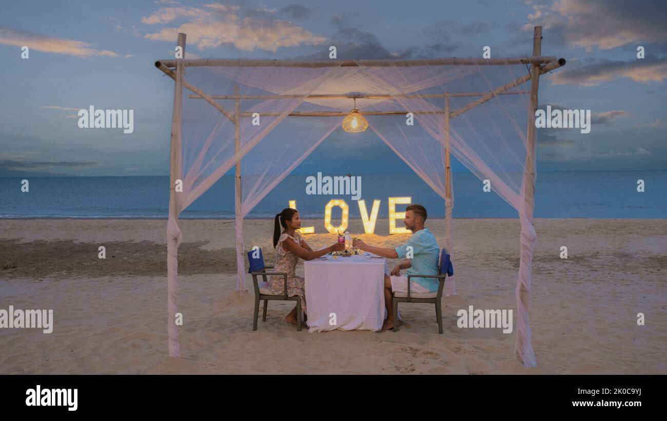 Romantic candlelight dinner on beach hi-res stock photography and ...