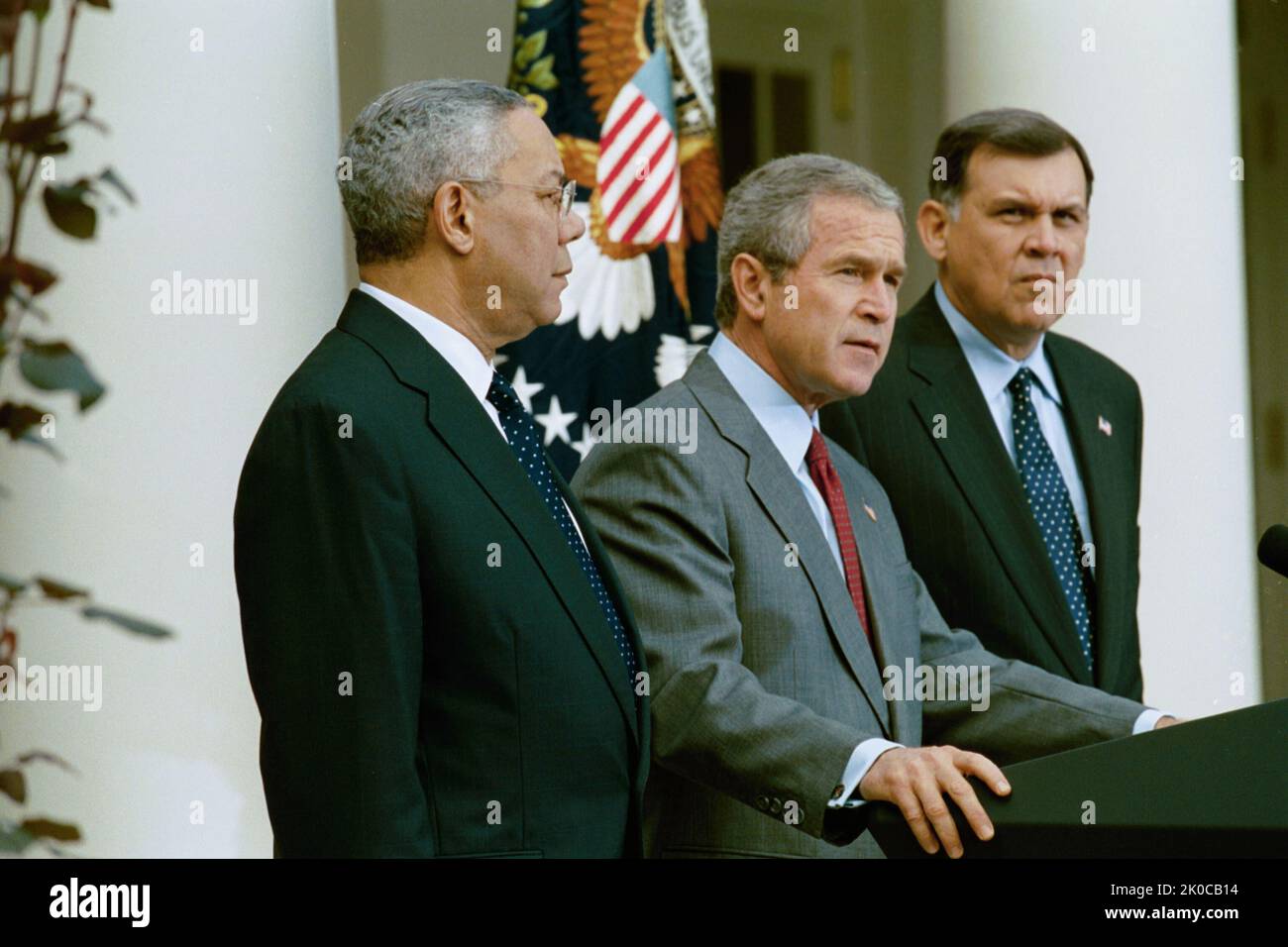 P34439-17.jpg. Secretary Mel Martinez at White House Announcement of Cuba Initiative Subject, Secretary Mel Martinez with President George W. Bush, Secretary of State Colin Powell at White House Rose Garden announcement of the Cuba Initiative--submission to Congress of the Tobacco Patriot and Assistance Act of 2003, providing production and educational training subsidies as well as tax breaks designed to revive American production of cigars to compete with Cuban imports and reduce the profitability of that important economic sector for the Fidel Castro regime. Stock Photo