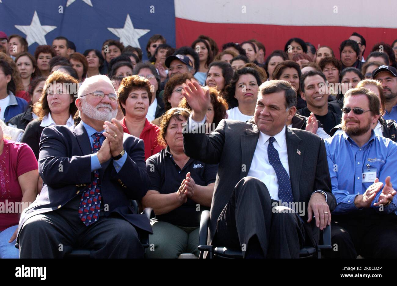 Secretary Mel Martinez with President George W. Bush in Dinuba, California. Secretary Mel Martinez with President George W. Bush in Dinuba, California Subject, Secretary Mel Martinez on visit to California, joining President George W. Bush for an appearance at the Dinuba headquarers of Ruiz Foods, leading frozen Mexican food manufacturer. Stock Photo