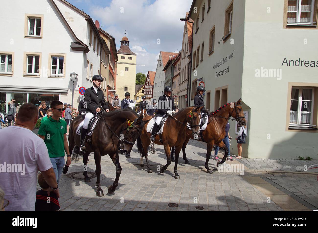 Parade after the festival, called Kirchweih in the German city of Weissenburgh in the Ellinger Strasse. Riders on horses. August Stock Photo