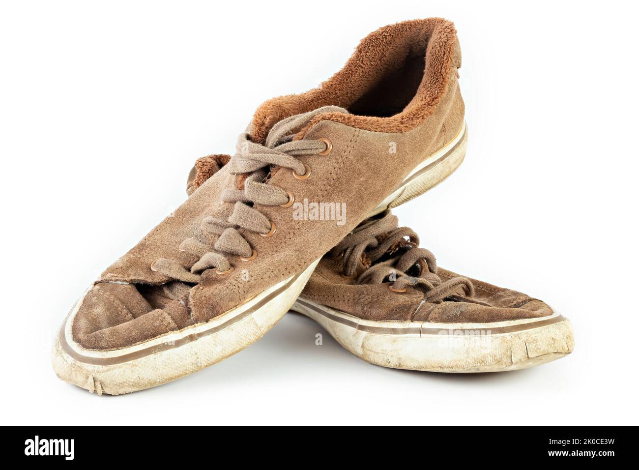 Old shabby dirty sneakers on a white background. Worn out shoes. Casual ...