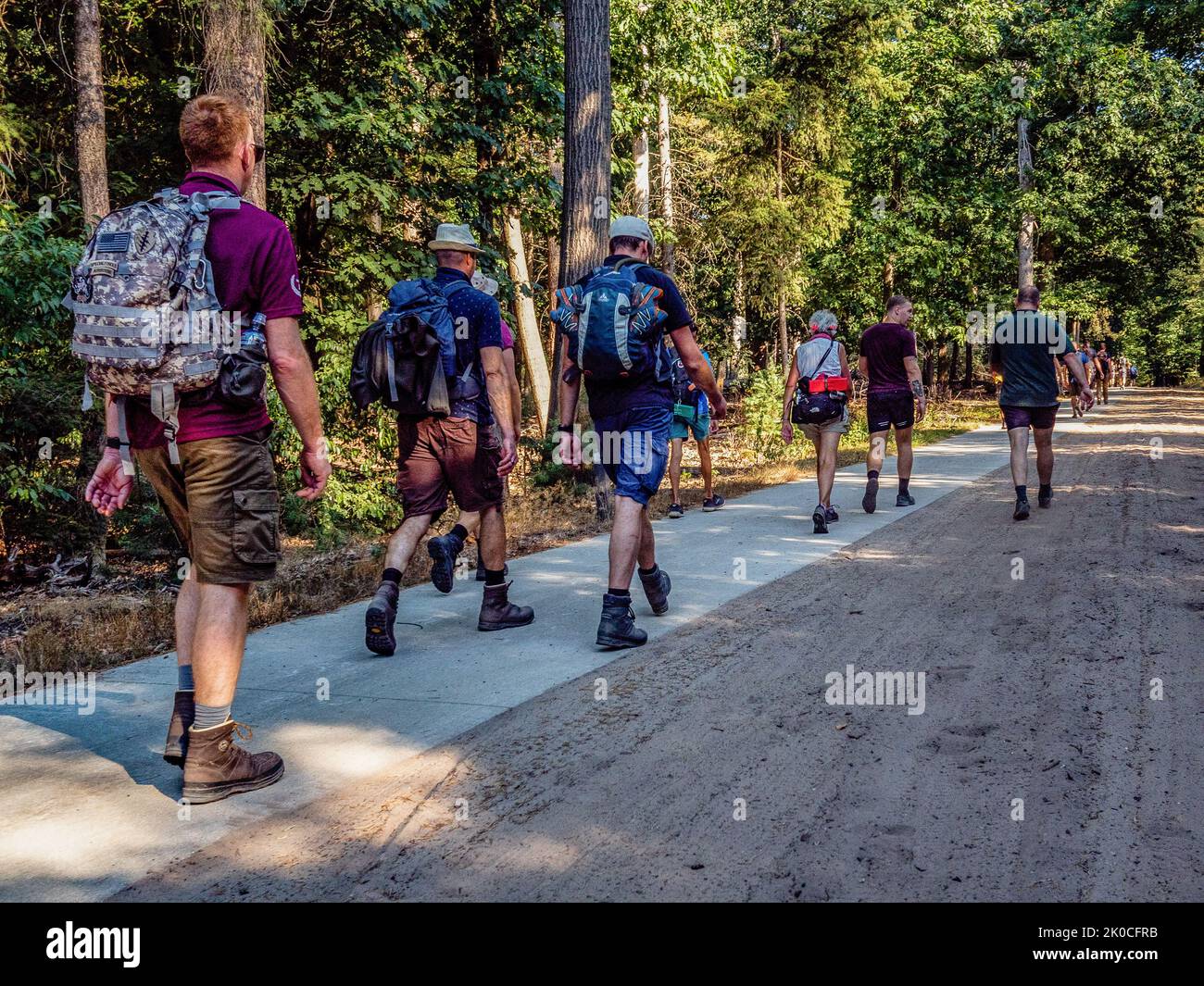 Participants are seen marching on a bike path. The Airborne march is the world’s biggest oneday