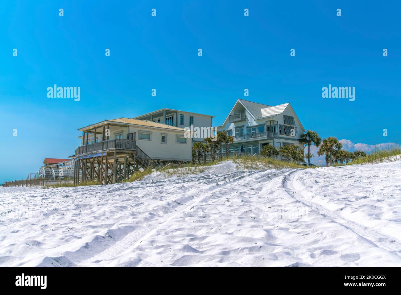 Beach houses on a white sand at a beach in Destin, Florida. There are