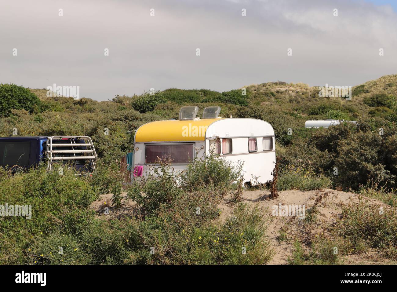 An old large caravan at a campsite Stock Photo