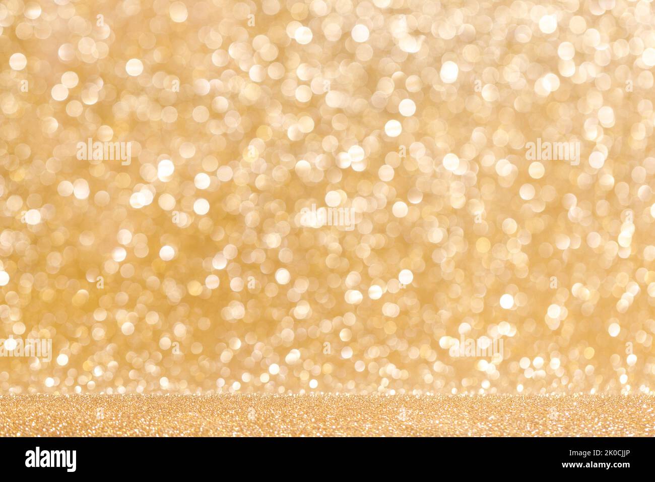 Glitter golden light blurred bokeh background, party holiday Christmas New Year luxury design, copy space for text content Stock Photo