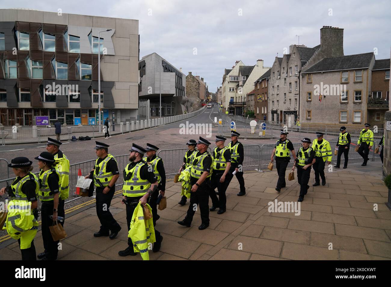 Police officers arrive at the Palace of Holyroodhouse in Edinburgh