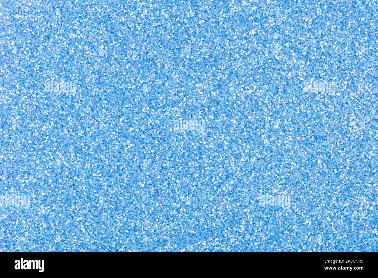 Glitter texture in gentle blue tone for Christmas individual creative design work. Sparkling shiny wrapping paper for New Year holiday seasonal Stock Photo