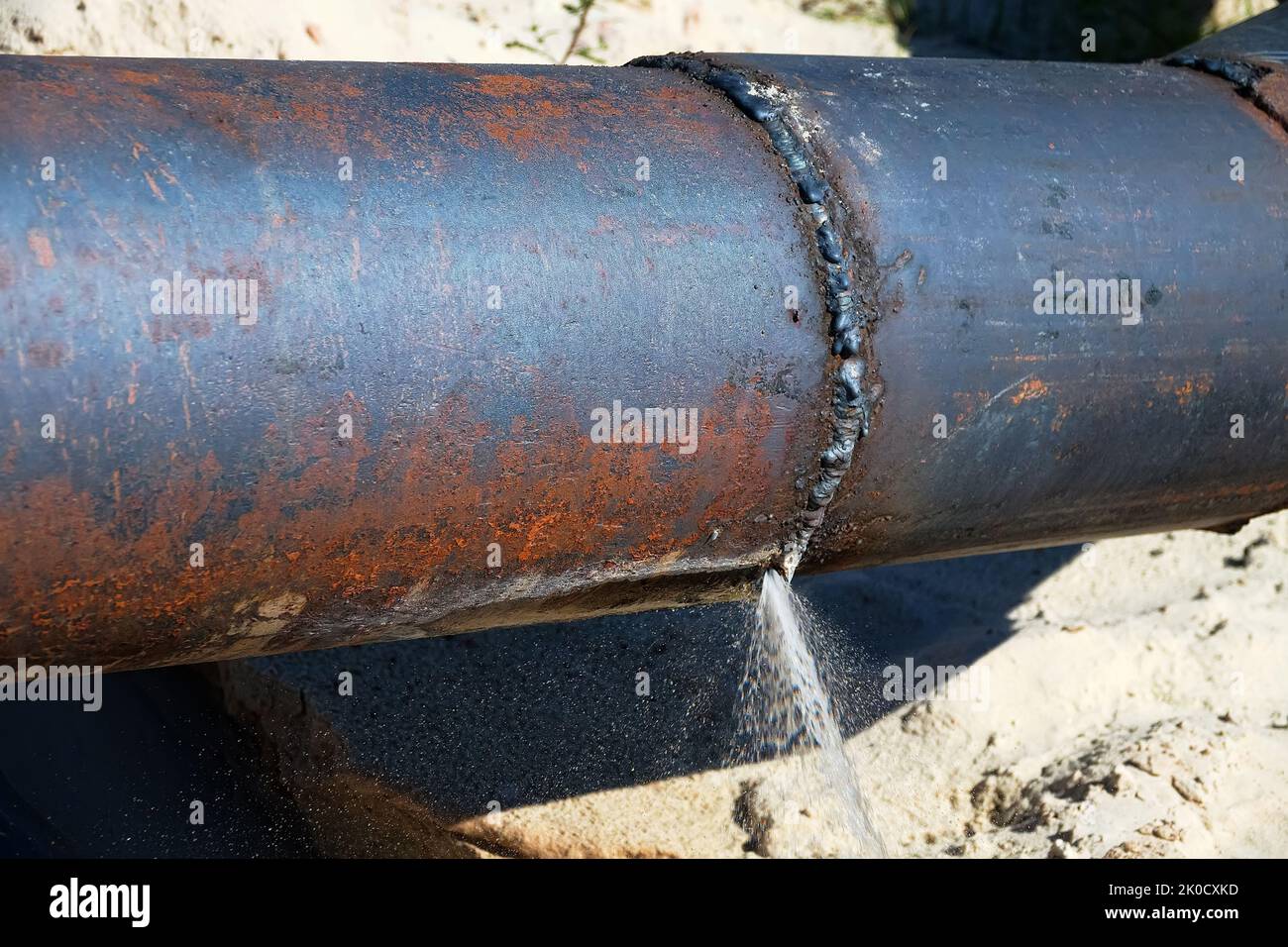 The water broke through an iron water pipe (busted water main). Lack of