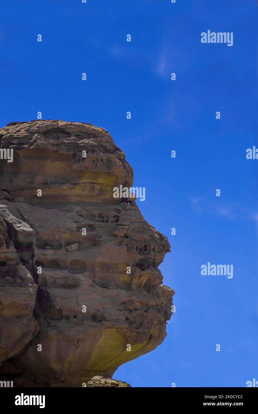 Extraordinary rock outcrop with profile of human face Hegra Saudi Arabia1 Stock Photo