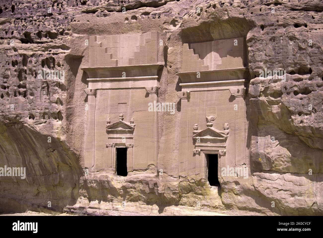 Two side by side skilfully carved tombs Jabal Al Ahmar Hegra Saudi Arabia Stock Photo