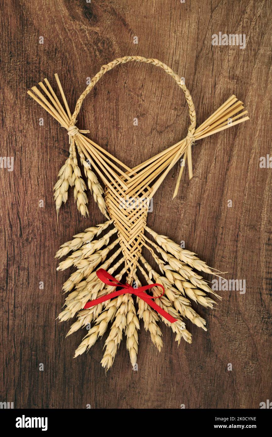 Corn husk doll for farm house protection blessing. Pagan symbol of fertility, success, good fortune, natural straw object also used in harvest rituals Stock Photo
