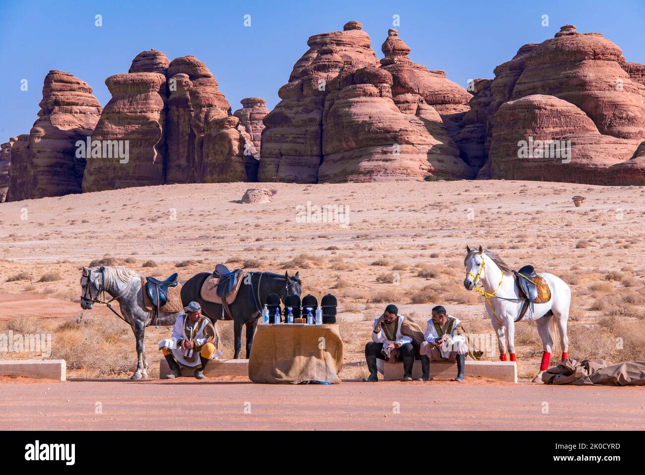Horse handlers waiting for tourist customers Hegra Saudi Arabia Stock Photo