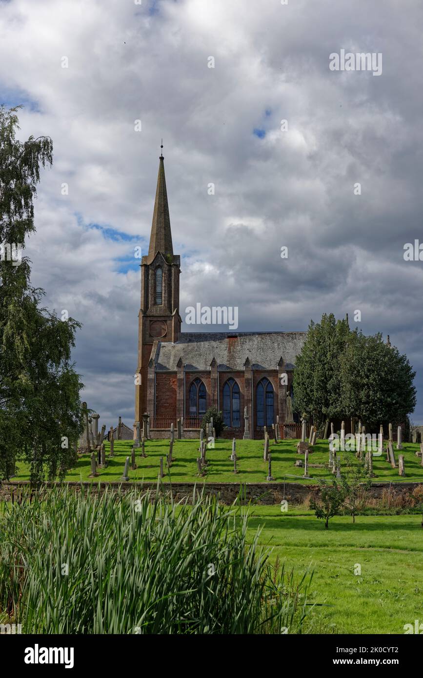 Fettercairn Parish Church of St Mark the Evangelist, set amongst its Oval Graveyard in the centre of the Small Village. Stock Photo