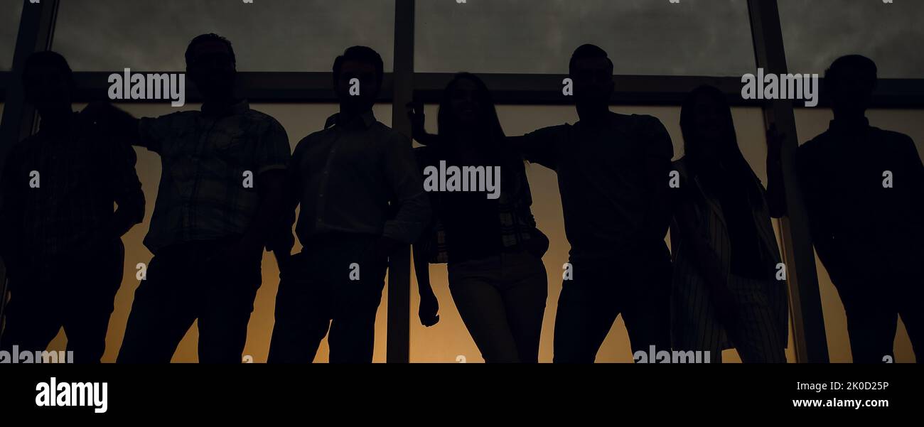 creative business team standing near the office window Stock Photo - Alamy