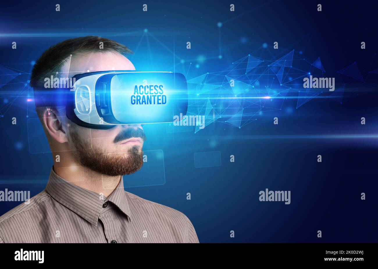 Businessman looking through Virtual Reality glasses, virtual security concept Stock Photo