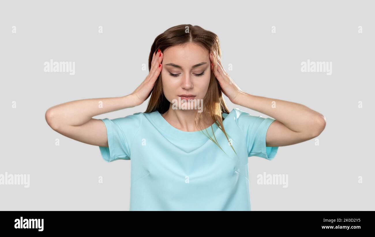 troubled woman migraine anxiety touching head Stock Photo