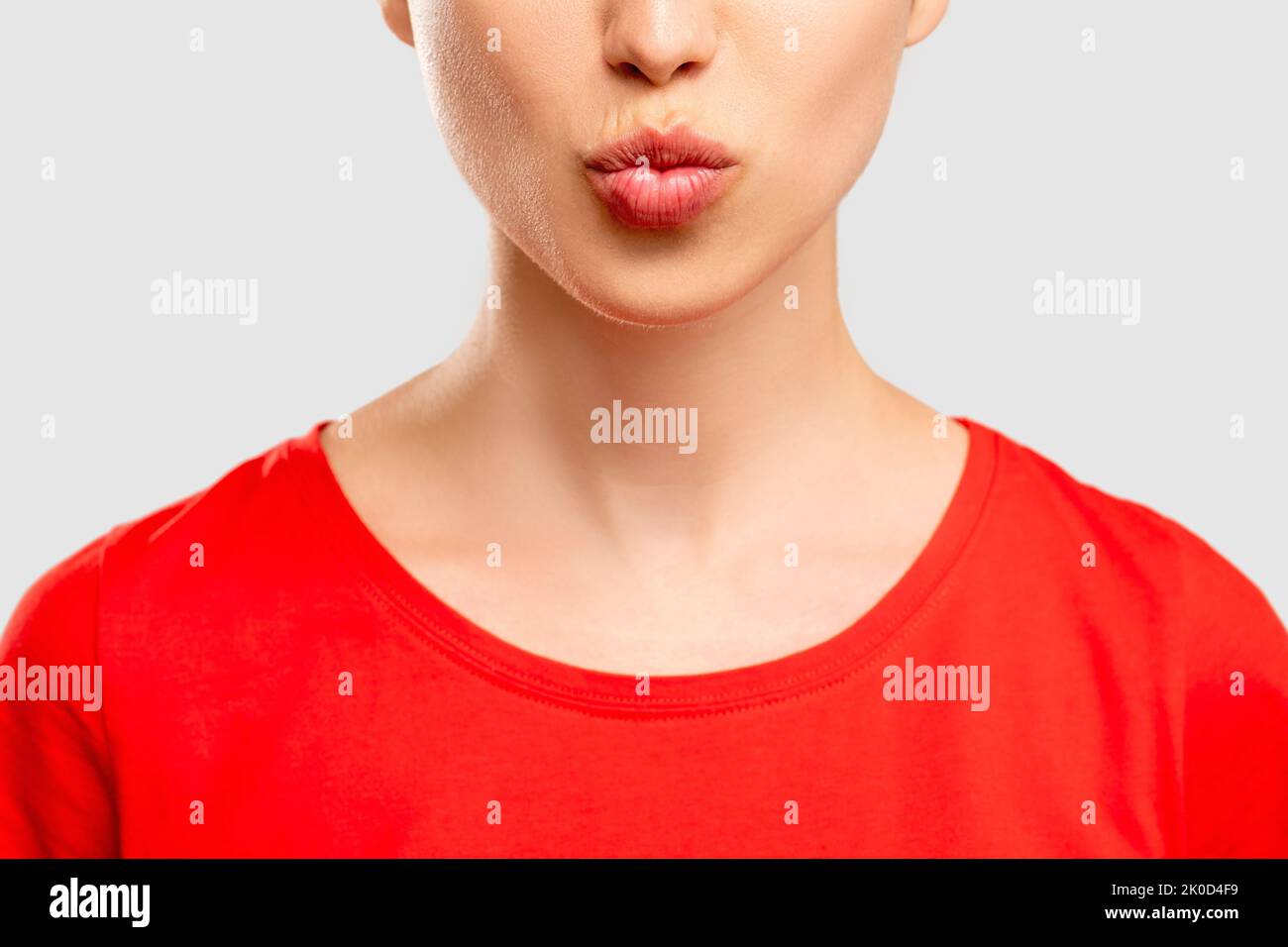 blowing kiss send love woman red t-shirt Stock Photo