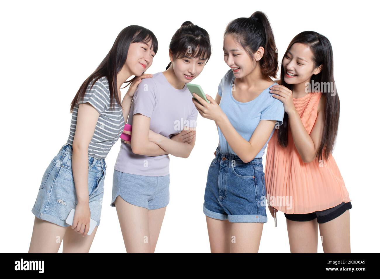 Cheerful Chinese college students using smart phone Stock Photo