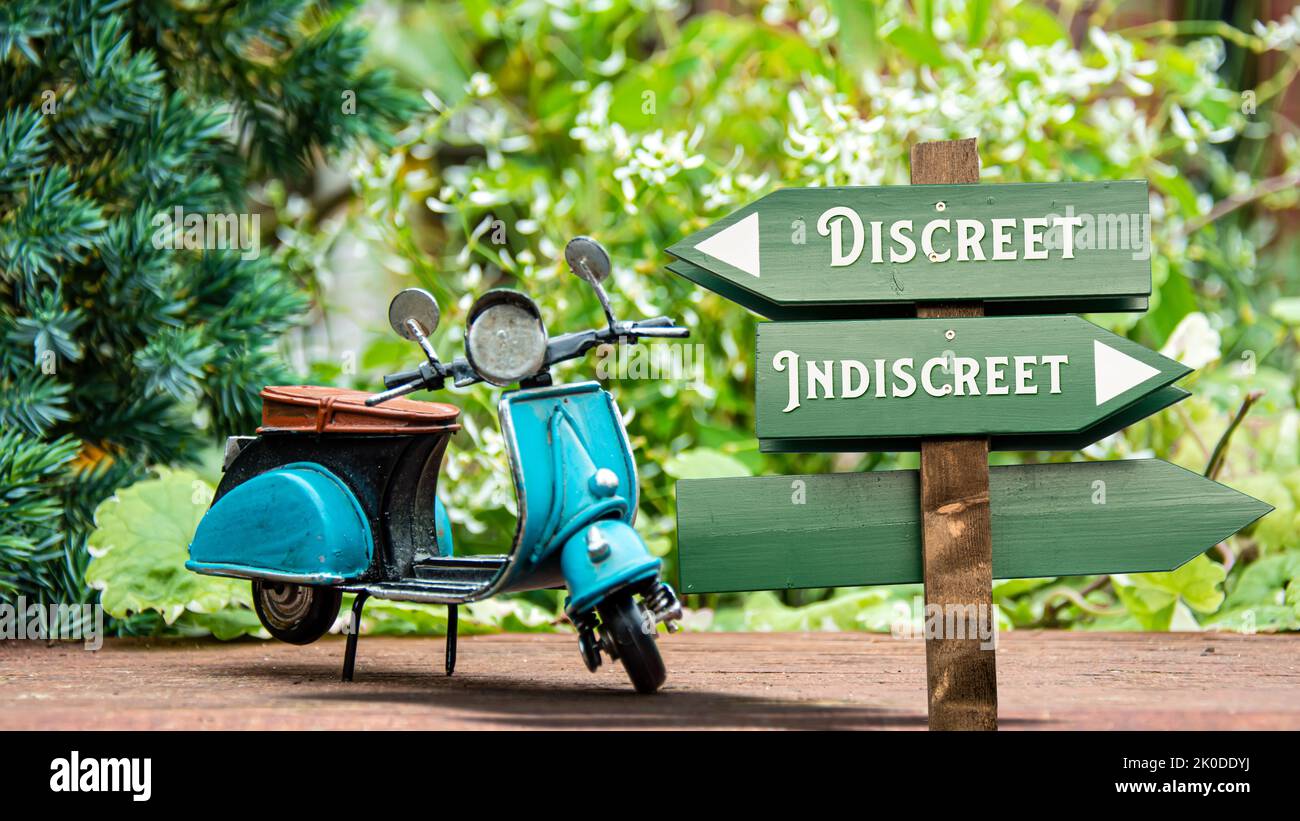 Street Sign the Direction Way to Discreet versus Indiscreet Stock Photo ...