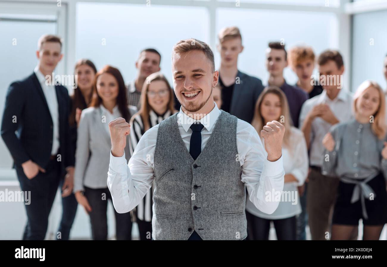 happy leader standing in front of the business team Stock Photo - Alamy