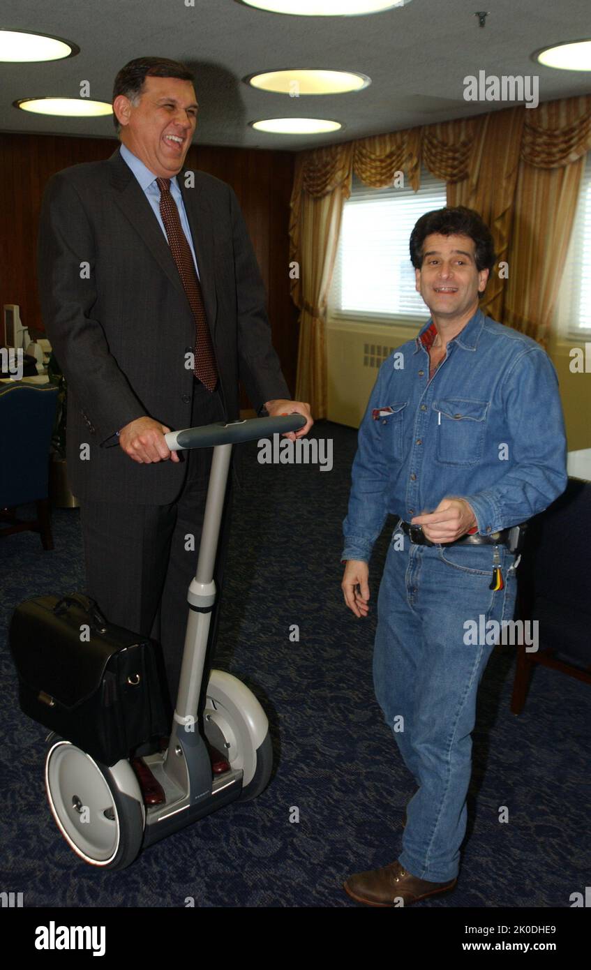 Secretary Mel Martinez, Staff Sampling Personal Transportation Device. Secretary Mel Martinez, Staff Sampling Personal Transportation Device Subject, Secretary Mel Martinez, other senior staff testing the Segway Human Transporter during visit to HUD Headquarters by the Segway's inventor, Dean Kamen. Stock Photo