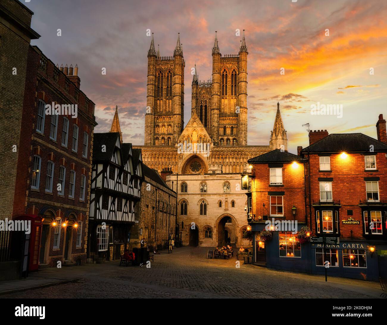The setting sun illuminates the clouds providing a beautiful backdrop befitting the majesty of Lincoln Cathedral. Stock Photo