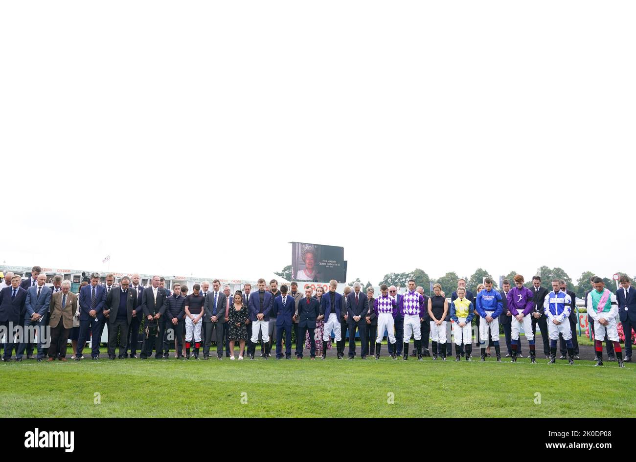 Jockey’s hold a 2 minutes silence following the death of Queen Elizabeth II on Thursday of at Doncaster Racecourse. Picture date: Sunday September 11, 2022. Stock Photo