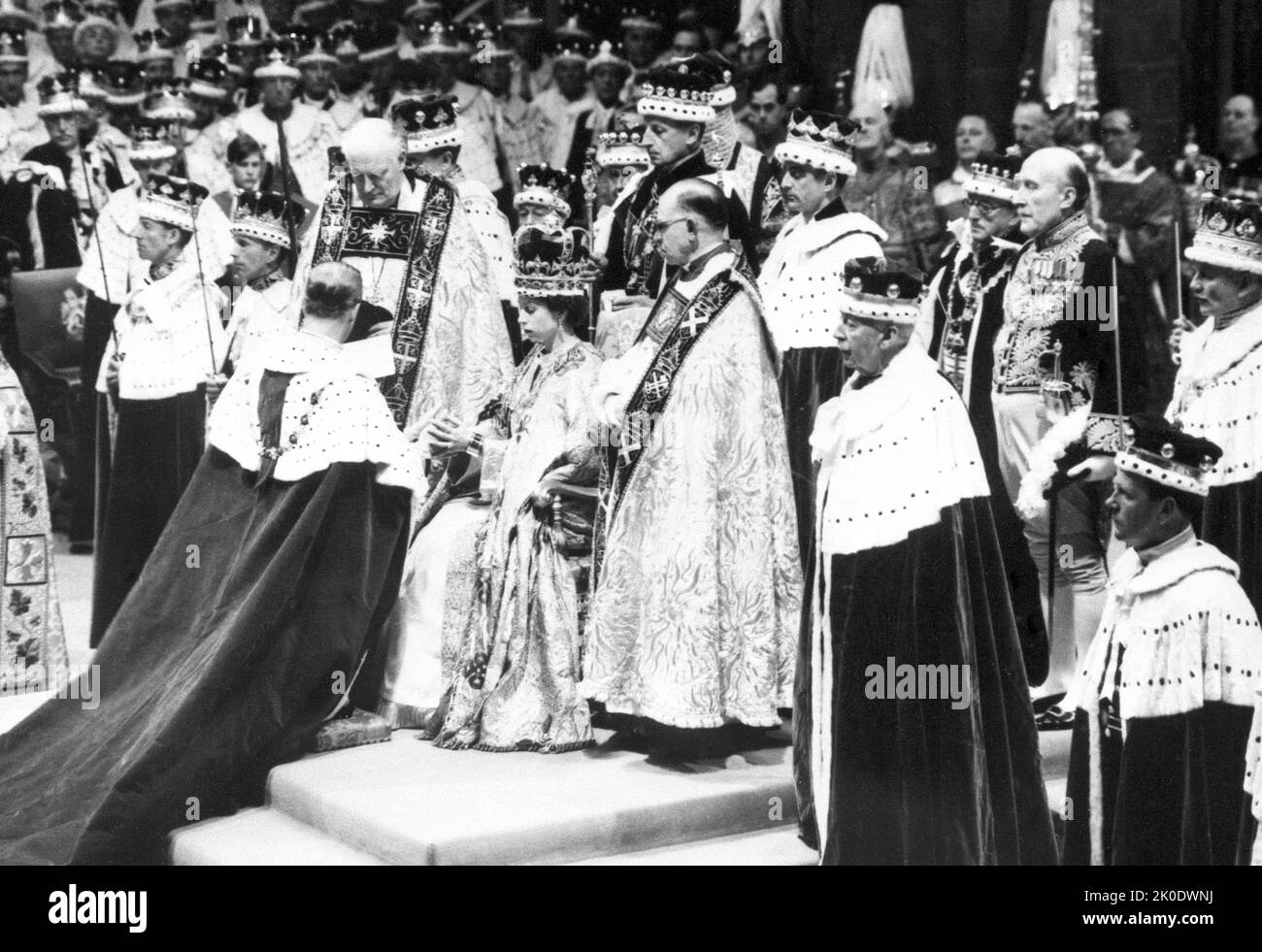 File photo dated 02/06/53 of Queen Elizabeth II receives the homage of the Duke of Edinburgh (her husband) at her coronation in London's Westminster Abbey as the Queen's funeral venue is where she was married and crowned. The monarch had close connections to the church - a focal point during times of national celebration and sadness. The Queen was married and crowned at Westminster Abbey. Now the bells of the 'House of Kings' - half muffled in mourning - will ring out at her funeral. It will be the first time in over 260 years a sovereign’s funeral has taken place in the Abbey. The last was Ge Stock Photo