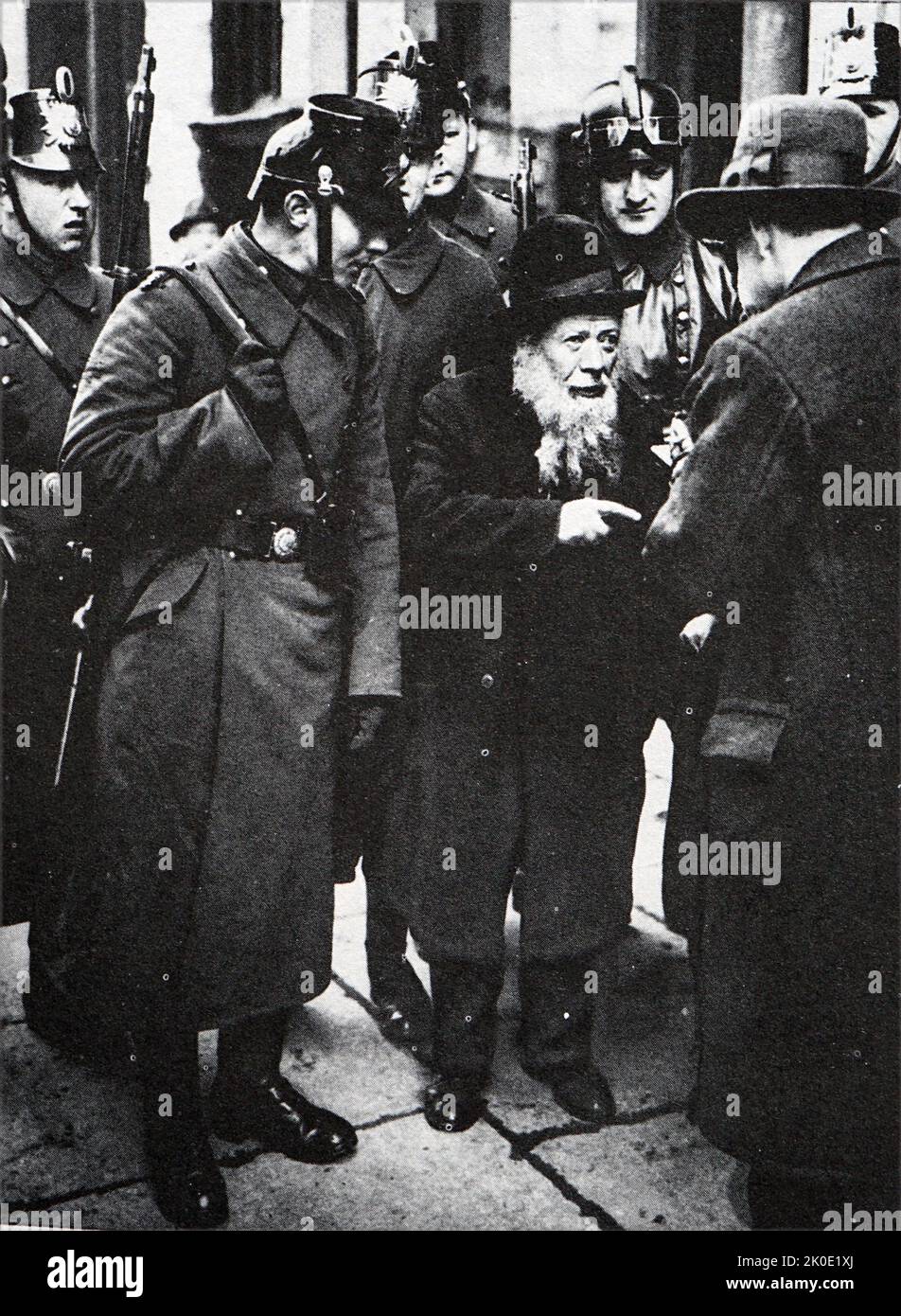 Anti-Semitism in Nazi Germany: Police questioning an old Jew in the Foreign Jews' Quarter in Berlin in 1933. Stock Photo