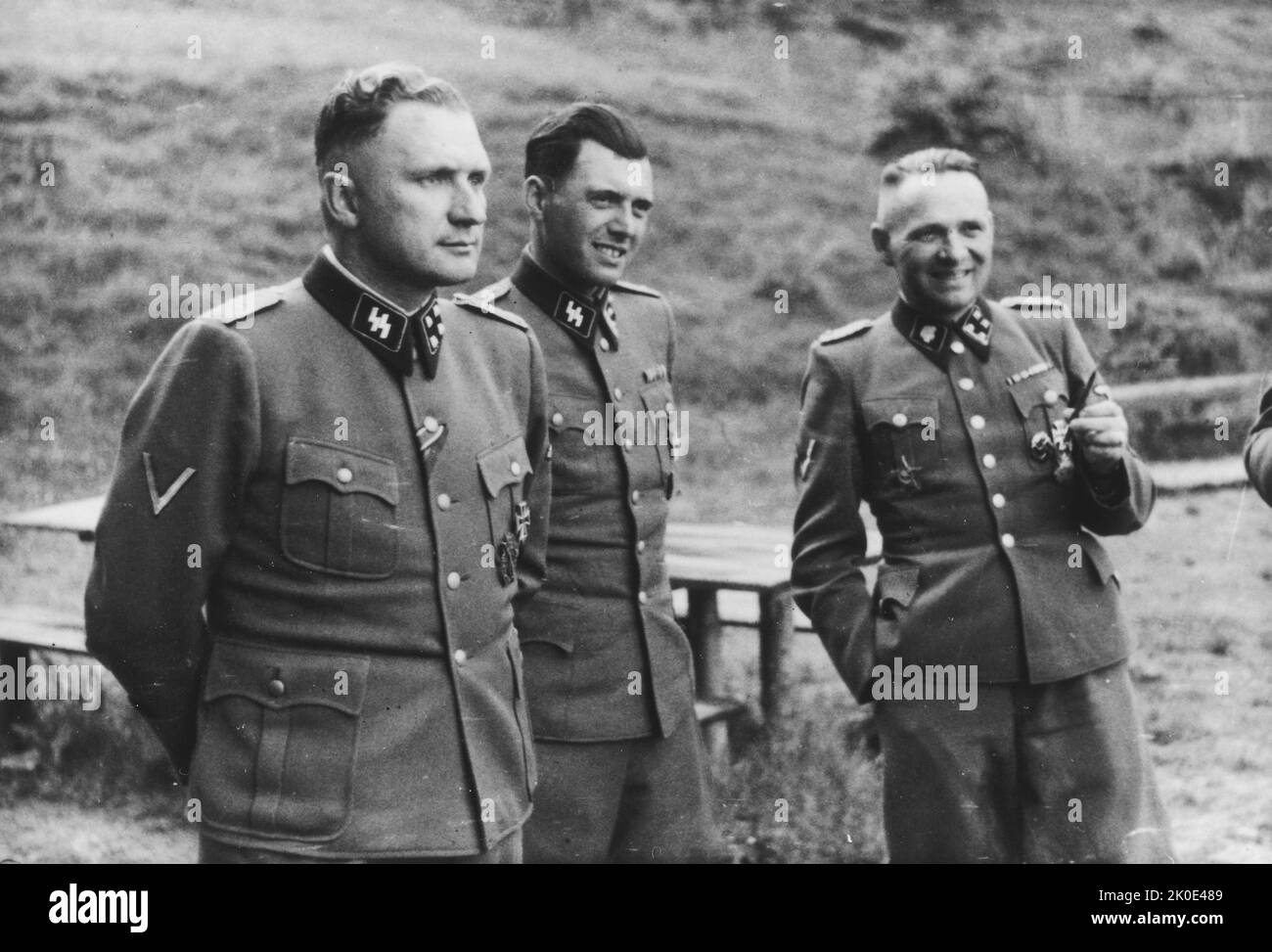 Auschwitz, Poland. Three SS officers socialize on the grounds of the SS retreat outside of Auschwitz, at 'Solahutte', 1944. From left to right they are: Richard Baer (Commandant of Auschwitz), Dr. Josef Mengele and Rudolf Hoess (the former Auschwitz Commandant). Stock Photo