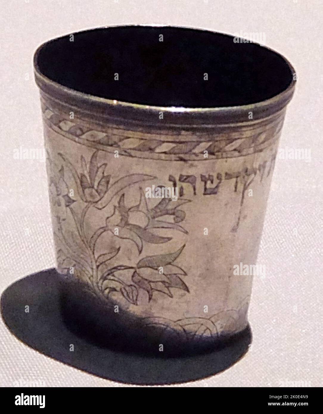 Cup for blessing over, wine, kiddush on the Jewish Sabbath. After saying the prayer, the head of the family sips the wine from the Kiddush goblet and passes it on to family members and other participants in the Sabbath meal, 2021. Stock Photo