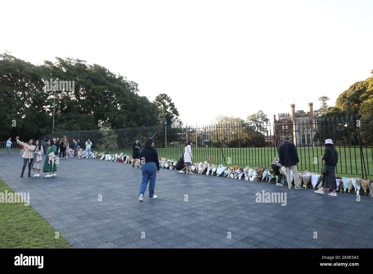 Sydney, Australia. 11th September 2022. Members of the public have been asked to leave flowers outside Government House, the official residence of the monarch’s representative for NSW. A slow trickle of people passed through to place flowers and pay their respects. Credit: Richard Milnes/Alamy Live News Stock Photo