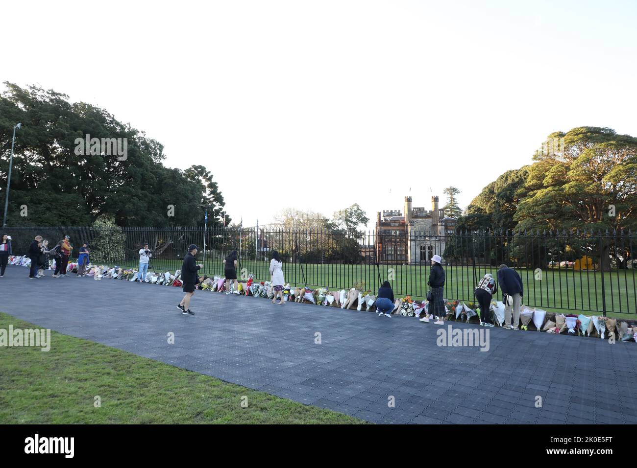 Sydney, Australia. 11th September 2022. Members of the public have been asked to leave flowers outside Government House, the official residence of the monarch’s representative for NSW. A slow trickle of people passed through to place flowers and pay their respects. Credit: Richard Milnes/Alamy Live News Stock Photo